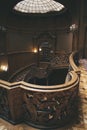 Wooden, carved stairs. Hall of the ancient palace. House of scientists in Lviv. Nice interior Royalty Free Stock Photo