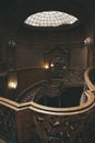 Wooden, carved stairs. Hall of the ancient palace. House of scientists in Lviv. Nice interior Royalty Free Stock Photo