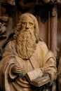 Wooden Carving of a Saint holding a Bible