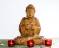 Wooden carvin buddha in meditation