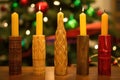wooden carving of seven kwanzaa candles