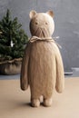 Wooden cat figure isolated on beige background Royalty Free Stock Photo