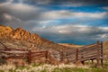 Wooden cattle loading ramp sits on the shady side of the hills Royalty Free Stock Photo