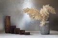 A ladder of wooden catwalks and pampas grass in a vase Royalty Free Stock Photo