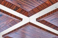 Wooden ceiling panels. Rosewood fineline veneer ceiling panels in the modern office Royalty Free Stock Photo