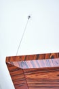 Wooden ceiling panels. Rosewood fineline veneer ceiling panels in the modern office