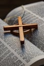 The wooden Celtic Cross is set on the words of the Bible it is a Christian cross with a nimbus or ring that emerged in Ireland