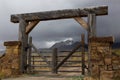 Wooden chained ranch gate and stone pillars Royalty Free Stock Photo