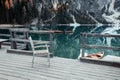 Wooden chair on the Alpine mountain lake. Lago di Braies