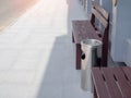 Wooden chair and ashtray in outdoor smoking area Royalty Free Stock Photo