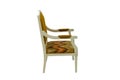 Wooden chair with a back and armrests in beige with brown soft upholstery on a white background. Side view.