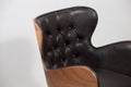 Wooden chair with a black leather seat isolated on a white background Royalty Free Stock Photo