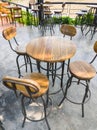 Wooden chair and circle table on the cement floor near the terrace Royalty Free Stock Photo