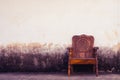 Wooden chair on concrete wall Royalty Free Stock Photo