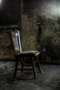 Wooden chair in derelict house