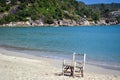 Wooden chair on a deserted beach