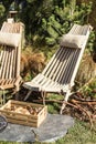 A wooden chair in a forest house, a box with mushrooms, berries. Holidays in the mountains, lifestyle Royalty Free Stock Photo