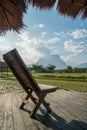 Wooden chair at the homestay terrace with rice paddy view