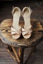 Wooden chair on it pink high-heeled sandals Royalty Free Stock Photo