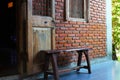 Wooden chair placed in front of the ancient house Royalty Free Stock Photo