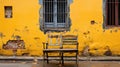 A wooden chair sitting in front of a yellow wall. Generative AI image. Royalty Free Stock Photo