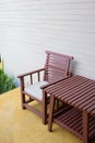 Wooden chair on yellow cement floor with mortar wall Royalty Free Stock Photo