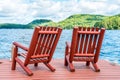 Wooden chairs on the dock on a late summers afternoon Royalty Free Stock Photo