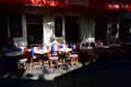 Wooden chairs with the French Flag at famous Chez Eugene cafe restaurant in Montmartre. Paris, France. Royalty Free Stock Photo