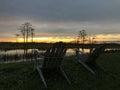 retirement and two chairs looking at the sunset in the swamp Royalty Free Stock Photo