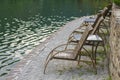 Wooden chairs near a natural pool Royalty Free Stock Photo