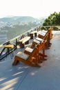 Wooden chairs without people against sunset in mountains of Da Lat in Vietnam Royalty Free Stock Photo