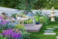 Wooden chairs on the plank terrace in the luxury colorful backyard garden 3d render