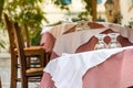 Wooden chairs and table with glasses at a Greek tavern - restaurant in Plaka, Athens Royalty Free Stock Photo