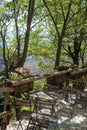 Wooden chairs, tables, mountain nature background Royalty Free Stock Photo