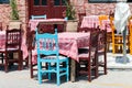 Wooden chairs and tables at traditional Greek tavern Royalty Free Stock Photo