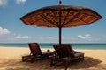 Wooden chairs and umbrellas on white sand beach Royalty Free Stock Photo