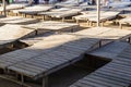 Wooden chaise lounge on the beach on a sunny day. Royalty Free Stock Photo