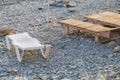 Wooden chaise lounge on the beach on a sunny day. Royalty Free Stock Photo