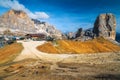 Wooden chalet and Cinque Torri rock formations in the Dolomites