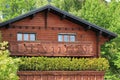 Wooden chalet among summer trees