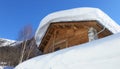 Wooden chalet under the snow in Val d`Isere Royalty Free Stock Photo