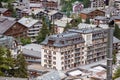 Wooden chalets and hotels in swiss village in Alps, Switzerland.