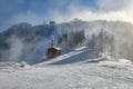 Wooden chalets and spectacular ski slopes in the Carpathians,Poiana Brasov ski resort,Transylvania,Romania,Europe,Pine forest Royalty Free Stock Photo