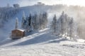 Wooden chalets and spectacular ski slopes in the Carpathians,Poiana Brasov ski resort,Transylvania,Romania,Europe,Pine forest Royalty Free Stock Photo