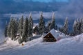 Wooden chalets and spectacular ski slopes in the Carpathians,Poiana Brasov ski resort,Transylvania,Romania,Europe,Pine forest Royalty Free Stock Photo