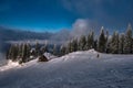 Wooden chalets and spectacular ski slopes in the Carpathians,Poiana Brasov ski resort,Transylvania,Romania,Europe,Pine forest Royalty Free Stock Photo