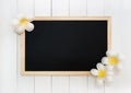 Wooden Chalkboard with Artificial White Plumeria Flowers