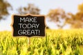 Wooden chalkboard sign with quote: MAKE TODAY GREAT