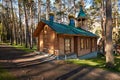 Wooden chapel in pine forest in Chemal