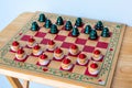 Wooden checker board game with Christmas tree and Santa pieces Royalty Free Stock Photo